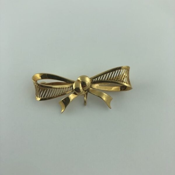 Prendedor en oro 18 K