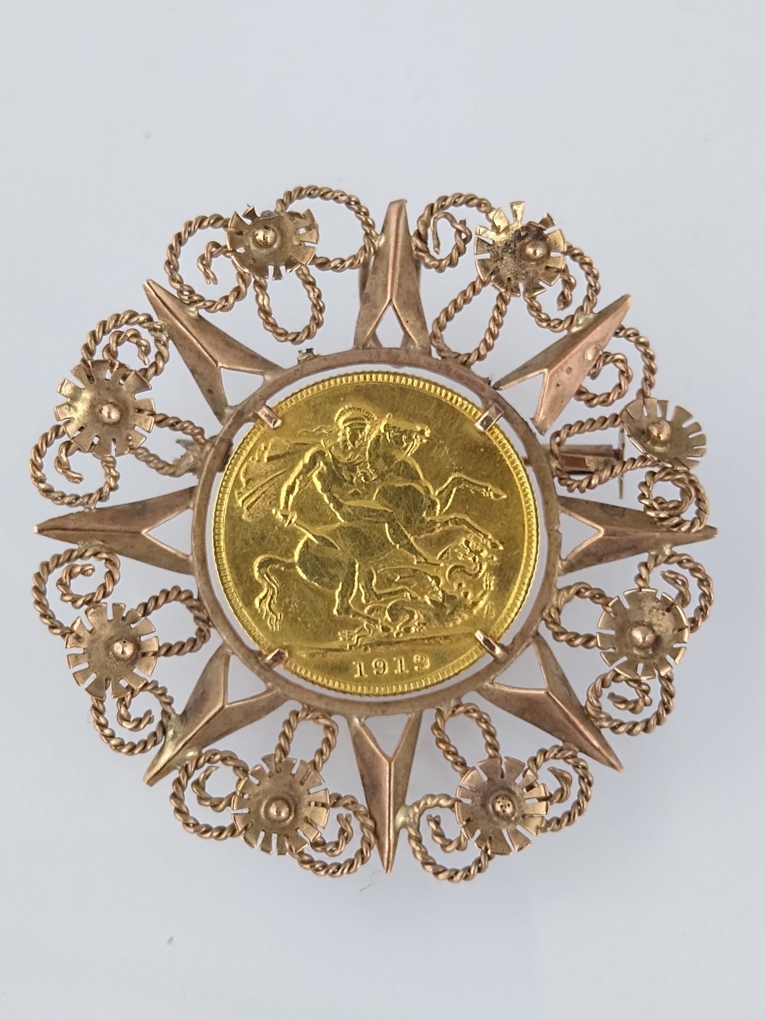 Prendedor oro