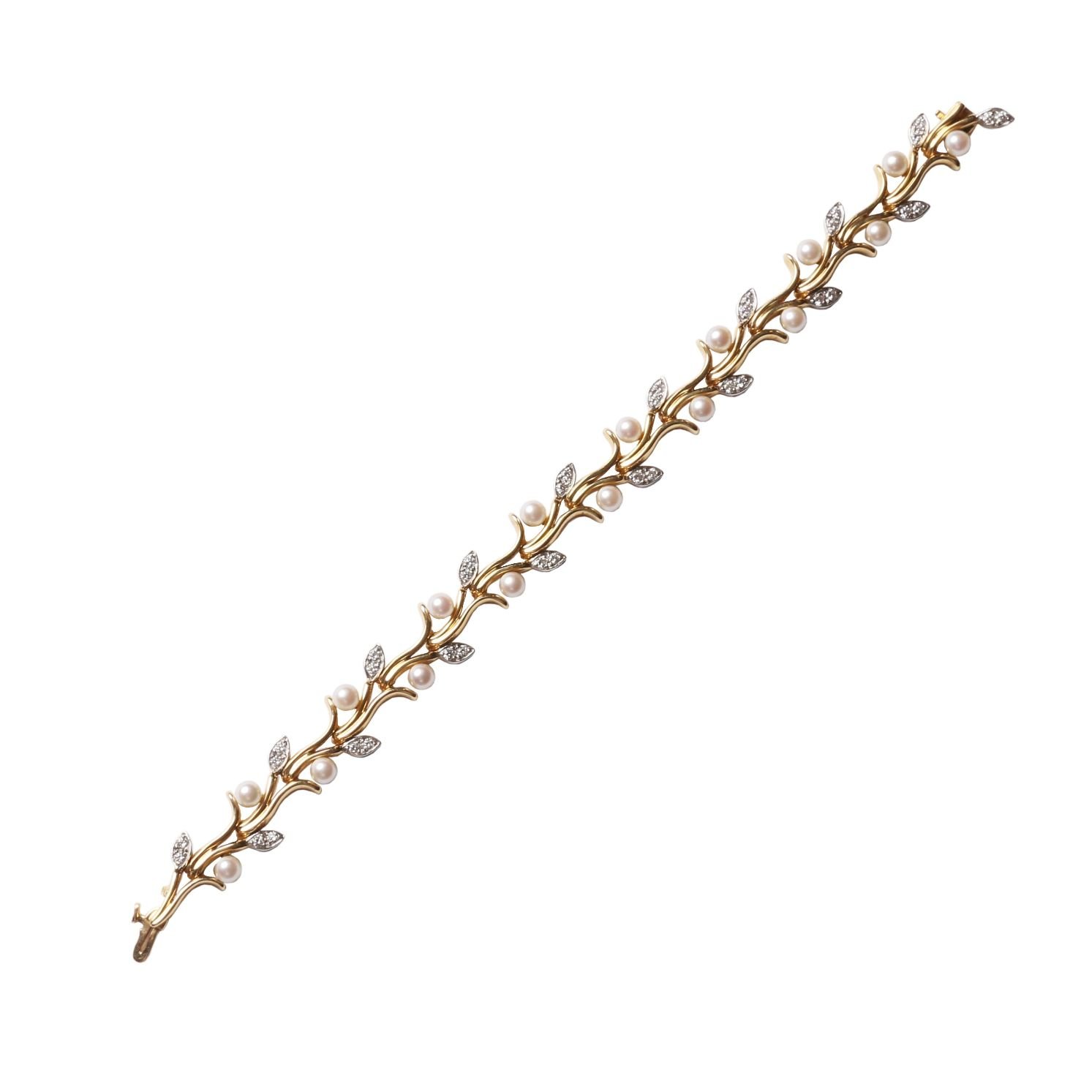 Pulsera Tiffany oro 18 K, platino, perlas y brillantes