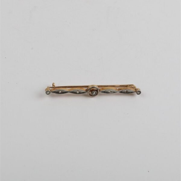 Prendedor oro 18 K, brillante y diamantes
