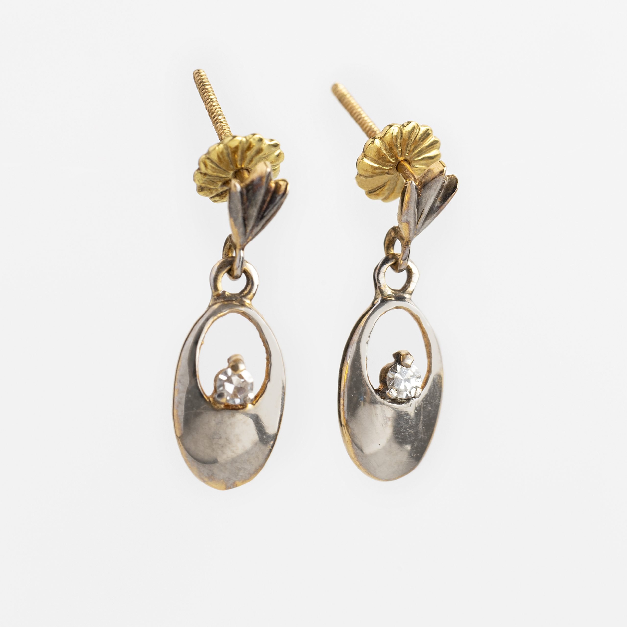 Par de caravanas oro y brillantes