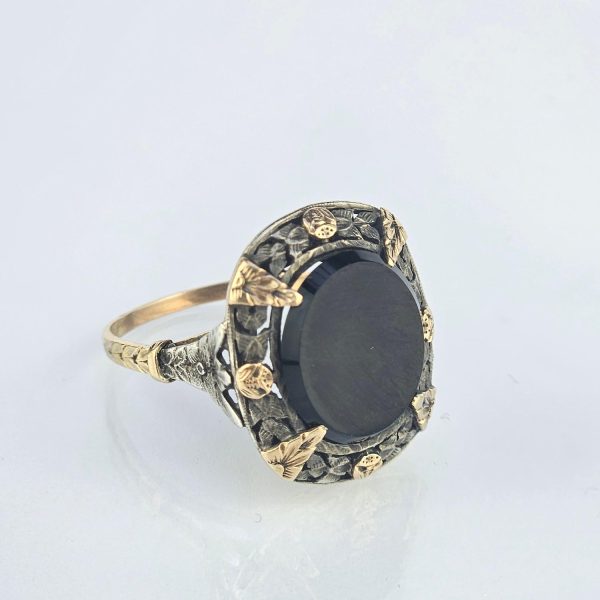 Anillo oro 18 Kn amarillo, plata y ónix
