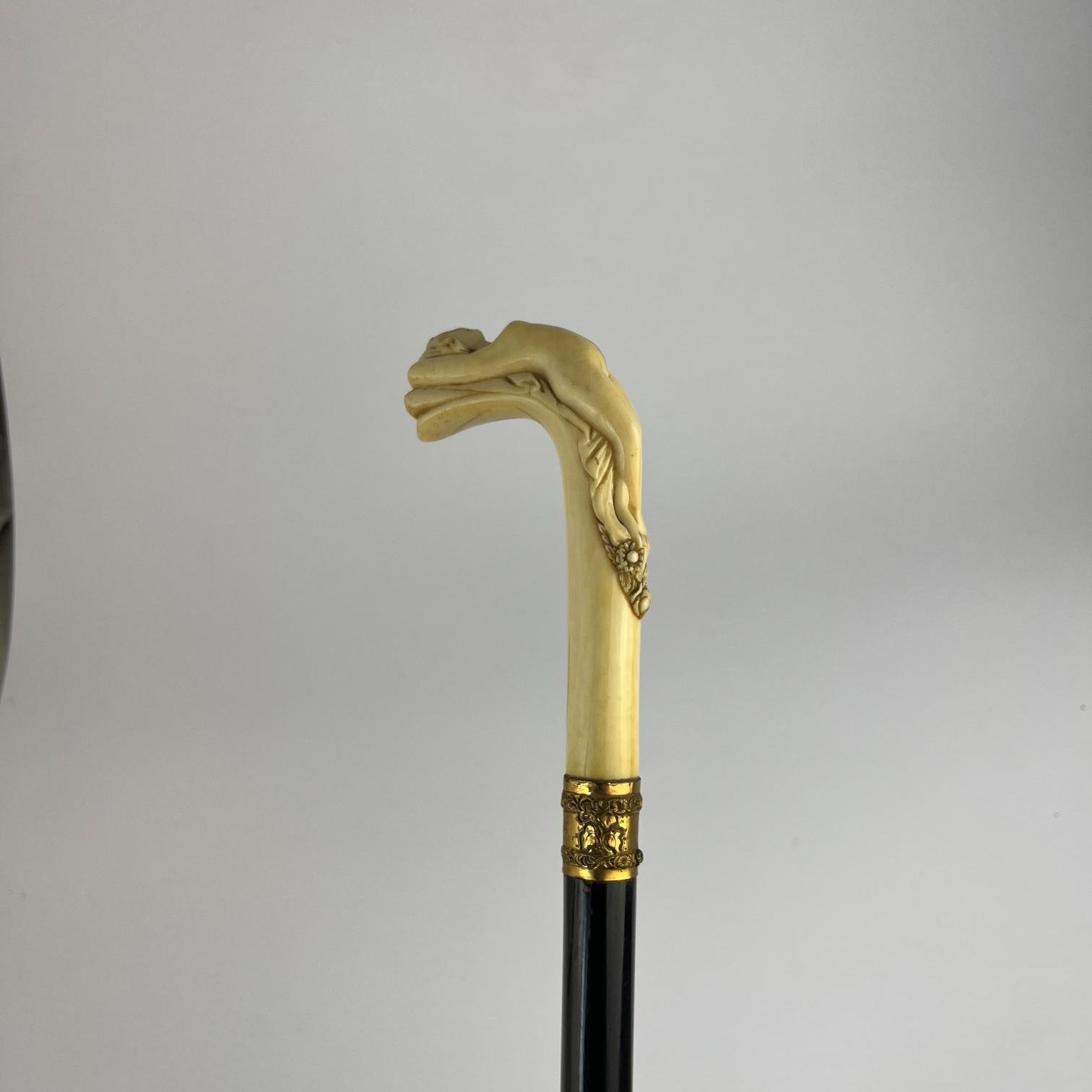 Bastón en madera, marfil, oro y bronce