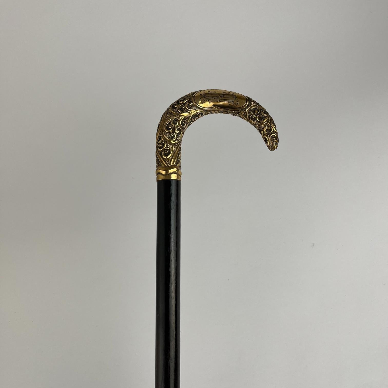 Bastón en madera y oro