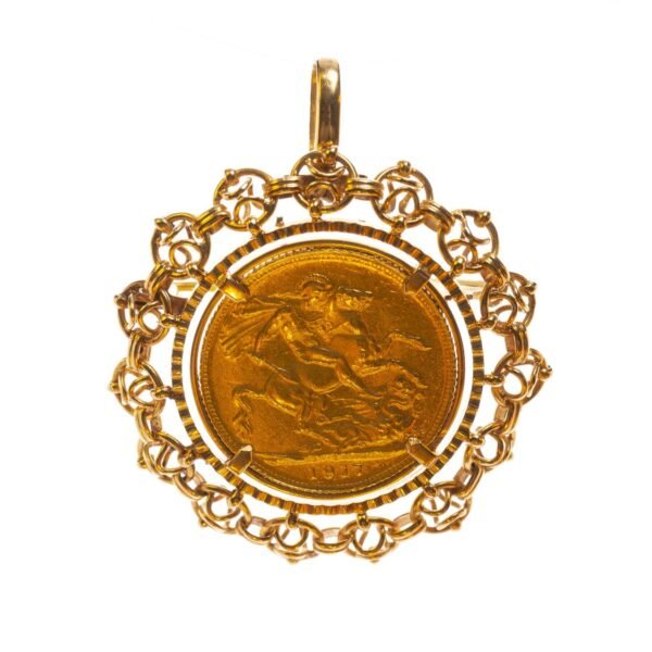 Prendedor en oro 18 K con una libra en oro