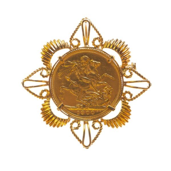 Prendedor en oro 18 K con una libra en oro