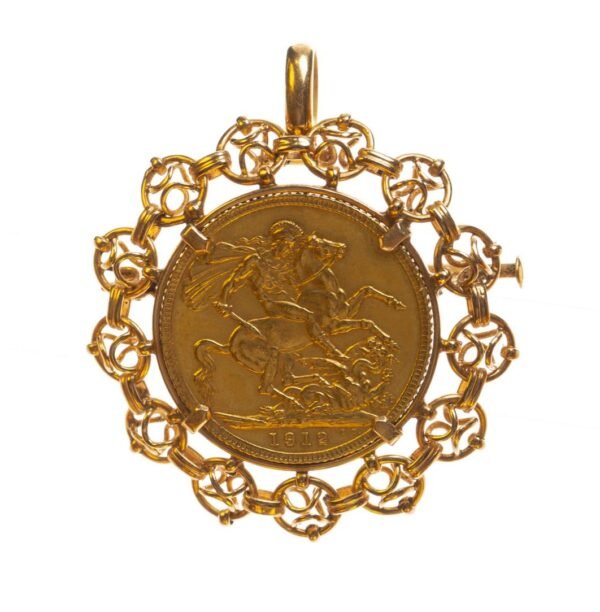 Prendedor en oro 18 K con una libra en oro