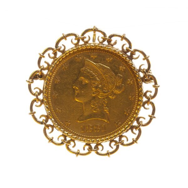 Prendedor en oro 18 K amarillo con moneda en oro
