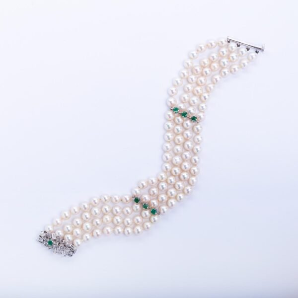 Pulsera en oro 18 K, perlas, esmeraldas y brillante