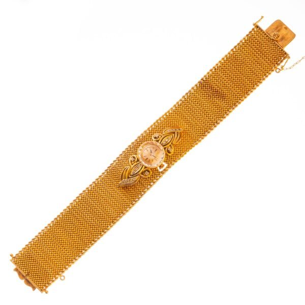 Brazalete con reloj pulsera en oro 18 K