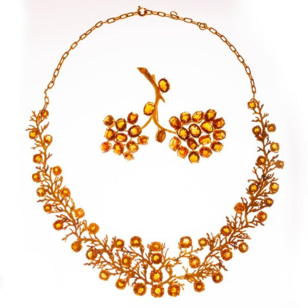 Set de gargantilla y prendedor en oro 18 K y topacios