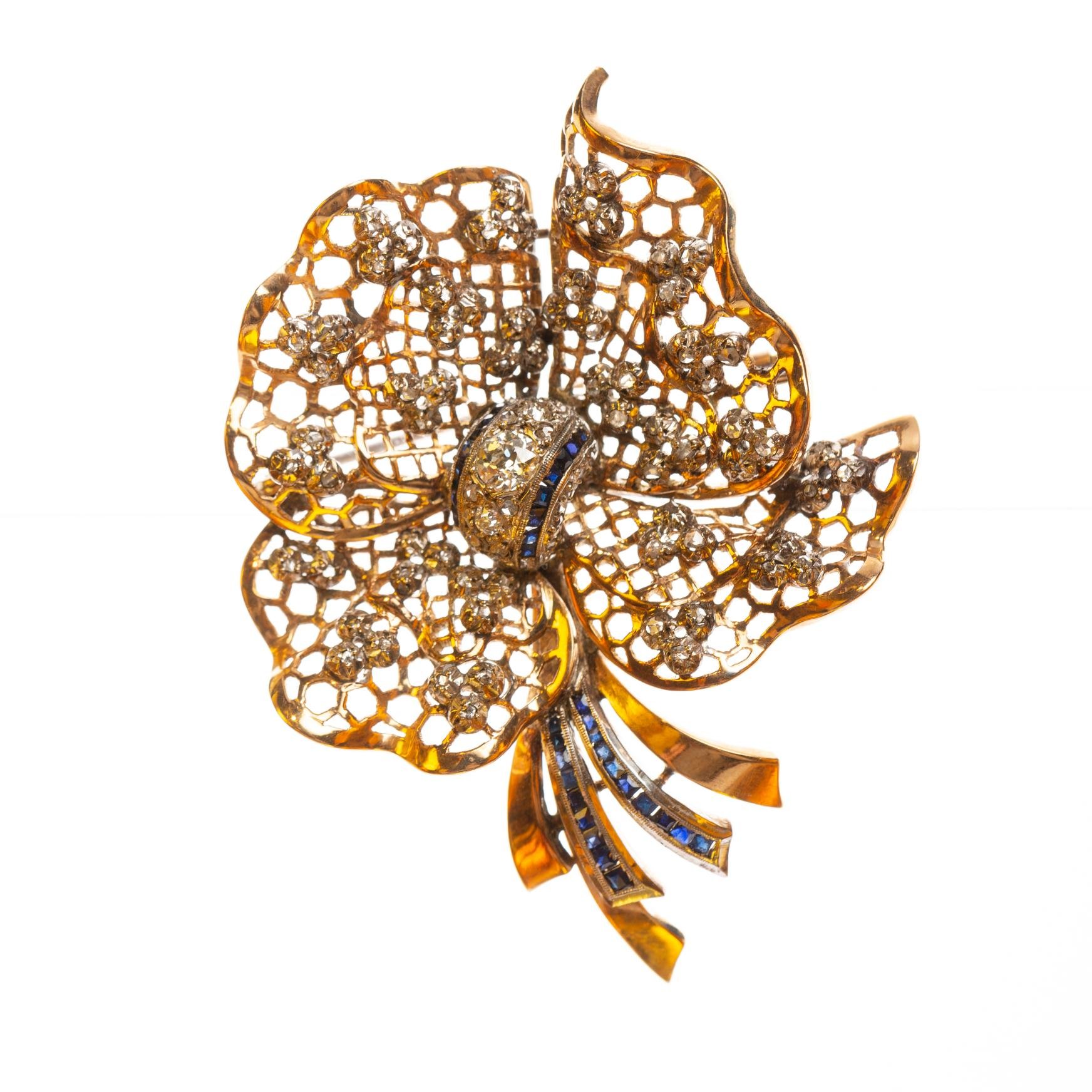 Prendedor en oro 18 K, diamantes y zafiros